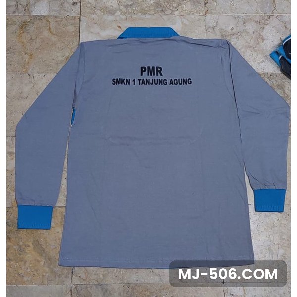 Kaos PMR SMK Negeri 1 Tanjung Agung Kaos PMR SMK Negeri 1 Tanjung Agung, kaos lengan panjang abu kombinasi biru dengan sablon tulisan PMR SMKN 1 Tanjung Agung di punggung